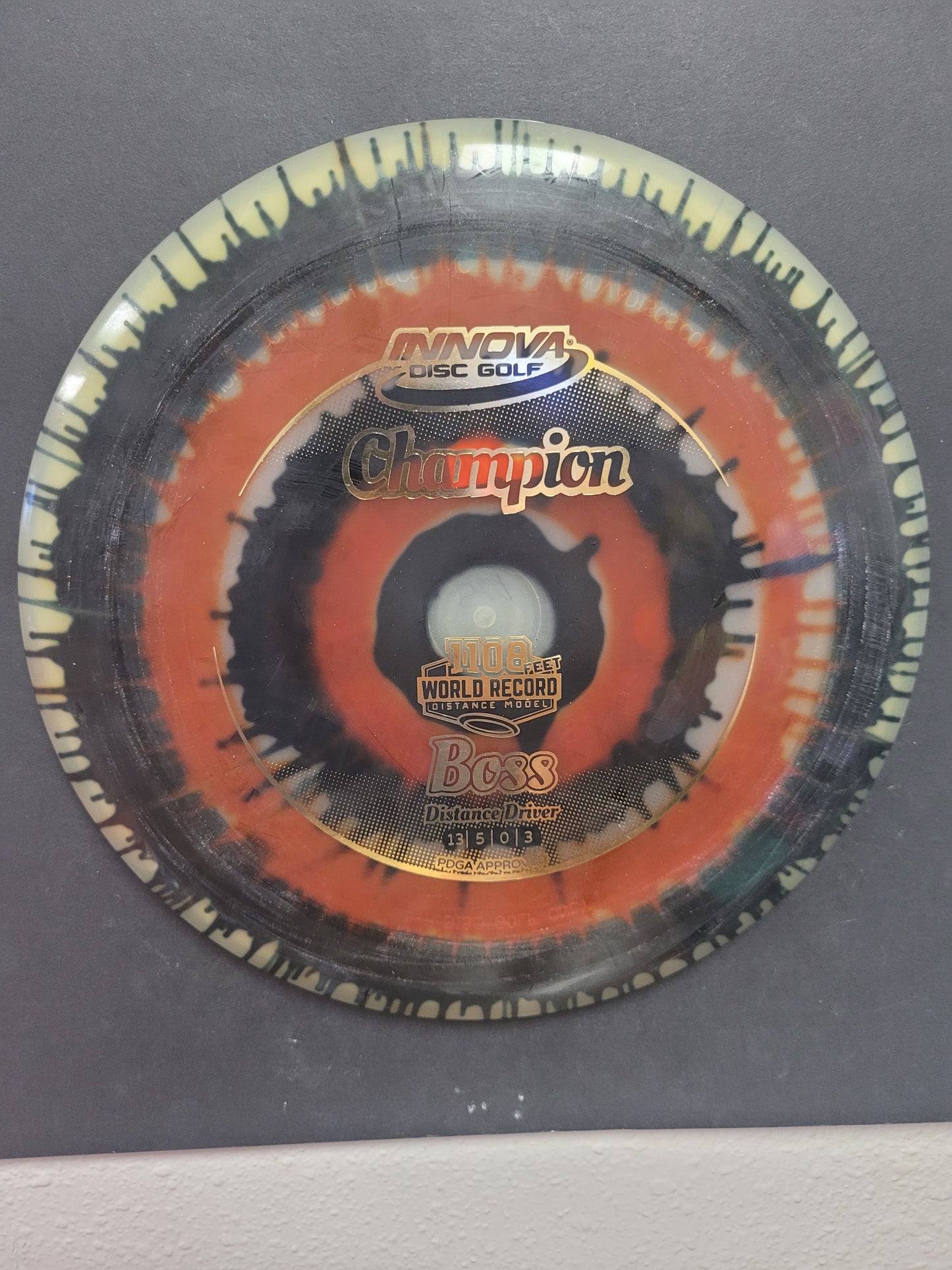 BOSS/CHAMPION DYED PLASTIC/DISTANCE DRIVER